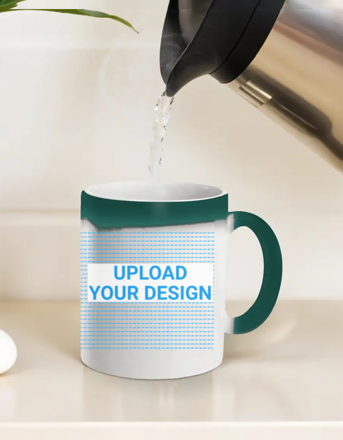 White mug with green rim and handle being filled with a white liquid, placed on a light surface.